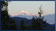 Mount Baker in Washington State looms over the Gulf Islands, North Pender Island